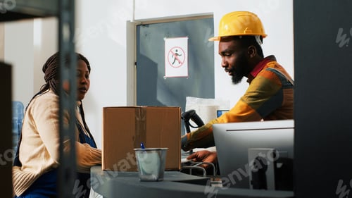Preview: Team of workers bumping fists before finishing shipment