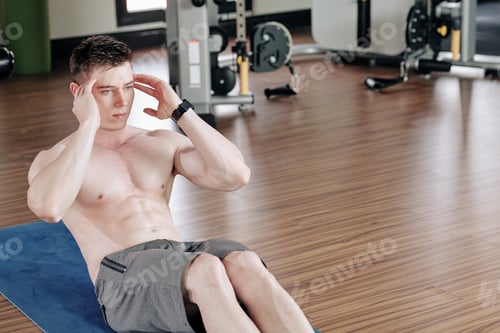 Preview: Young man doing sit-ups