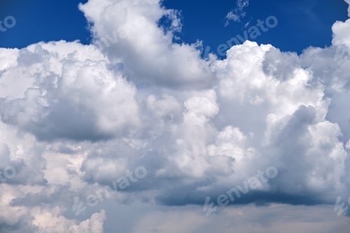 Preview: Bright landscape of white puffy cumulus clouds on blue clear sky