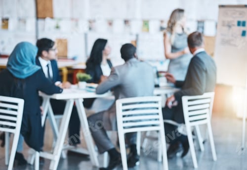 Preview: Defocussed shot of a team of businesspeople attending a presentation in the boardroom