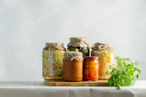 Preview: Fermented preserved or canning various vegetables zucchini sauerkraut carrots cucumbers in glass