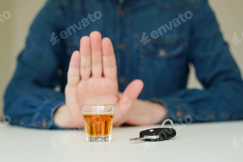 Preview: Drink no drive concept. Man showing stop gesture to drunk driving.