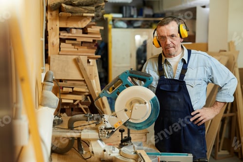 Preview: Senior Carpenter Posing in Workshop