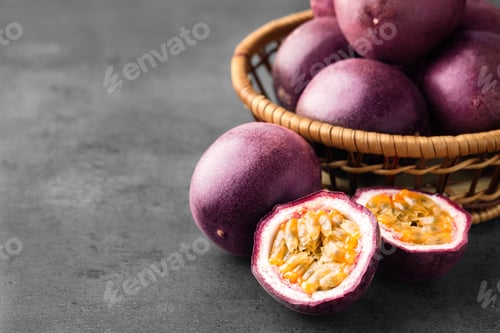 Preview: Fresh passion fruits on grey table, closeup. Space for text