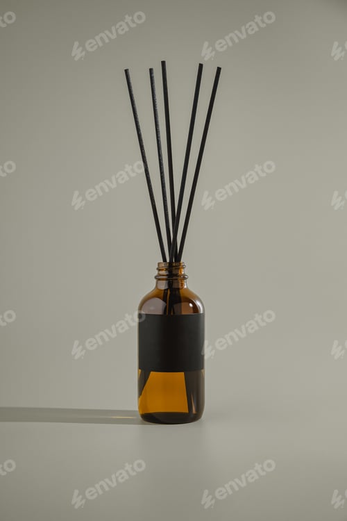 Preview: Glass bottle for aroma diffuser in minimalist advertising style.