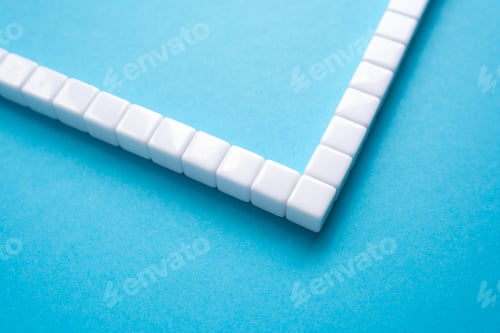 Preview: Frame made of white blocks on a blue background. Abstraction