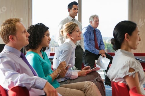 Preview: Office workers taking notes in meeting room