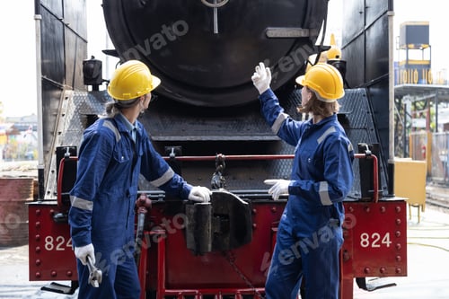 Preview: Portrait of Engineer train Inspect the train's diesel engine, railway track in depot of train