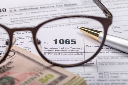 Preview: Income tax with instruction, money and glasses. Tax payment and filing concept