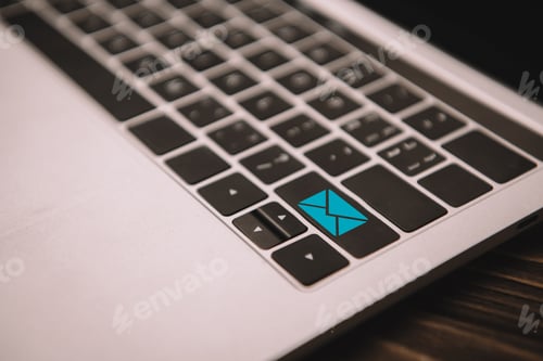 Preview: close up of laptop keyboard with email icon on button