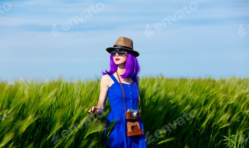 Preview: young woman with camera