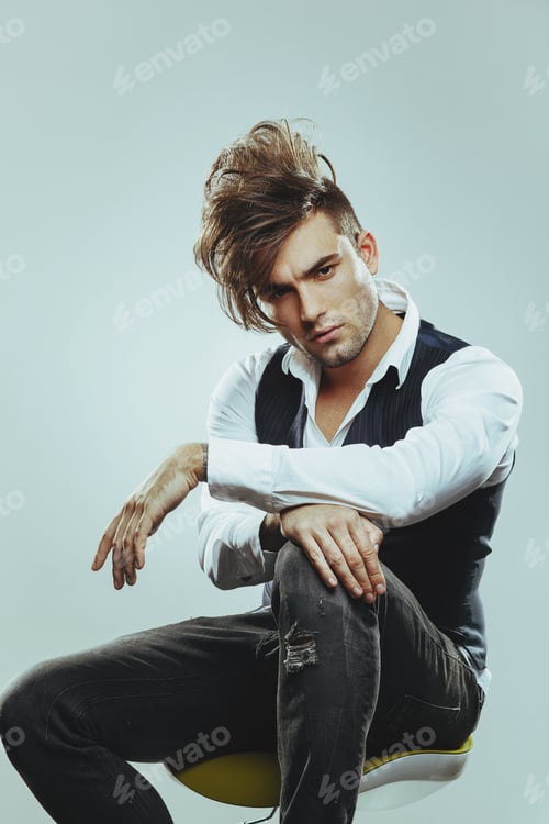 Preview: Fashionable man posing in the studio