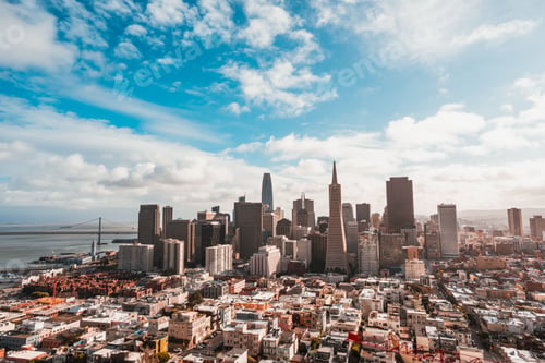 Preview: Cityscape with a cloudy sky of the Transamerica Pyramid Skyscraper in San Francisco, California, USA