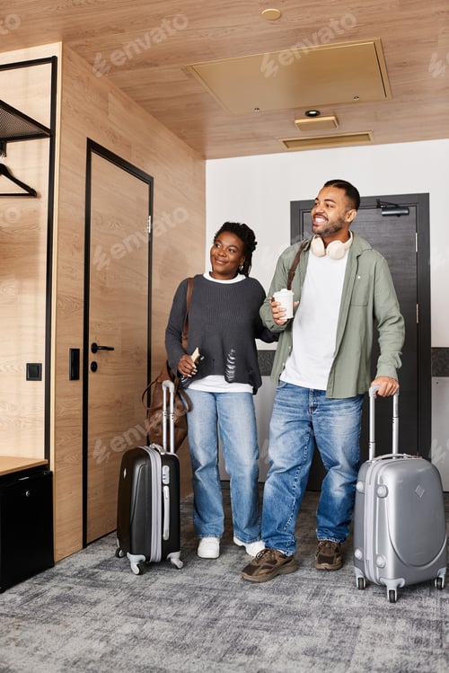 Preview: Young African American couple enjoying a vacation together in a hotel room full of love