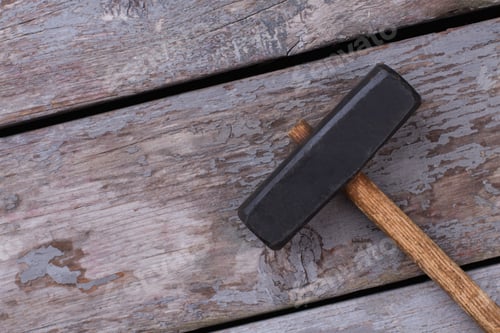 Preview: Sledge hammer on rustic wooden boards