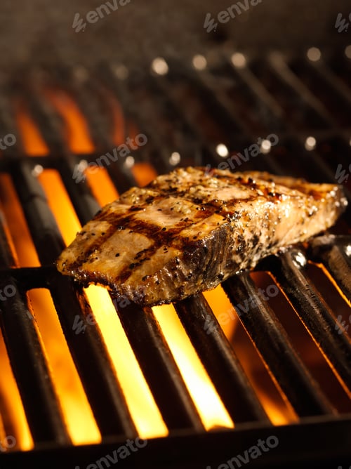 Vista previa: salmon fillet on the grill with flames