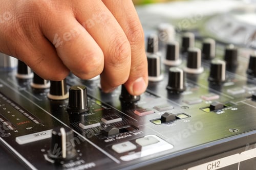 Preview: DJ Hands creating and regulating music on dj console mixer in concert party outdoor openair
