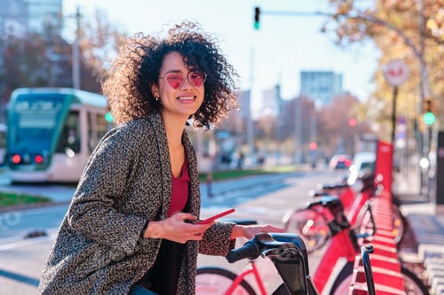 Preview: Woman looking at camera while using the public bike system