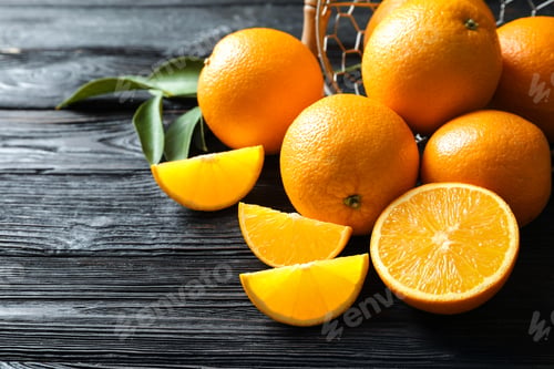Preview: Fresh ripe oranges on wooden background. Space for text