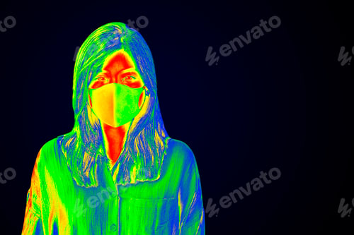 Preview: Woman wearing a face mask during coronavirus pandemic thermal image