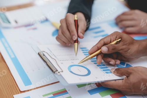 Preview: Business people meeting pointing graph and chart to analyze financial and marketing investment.