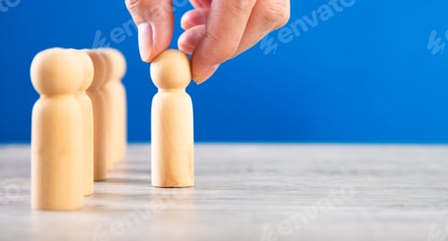 Preview: successful team leader, businessman hand choose people standing out from the crown.