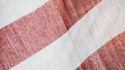 Preview: Close-up shot of the red and white stripes of the American flag