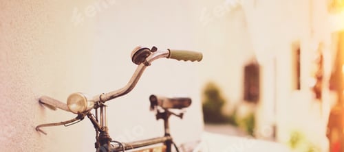 Preview: Classic Bicycle parked next to wall in bright backdrop