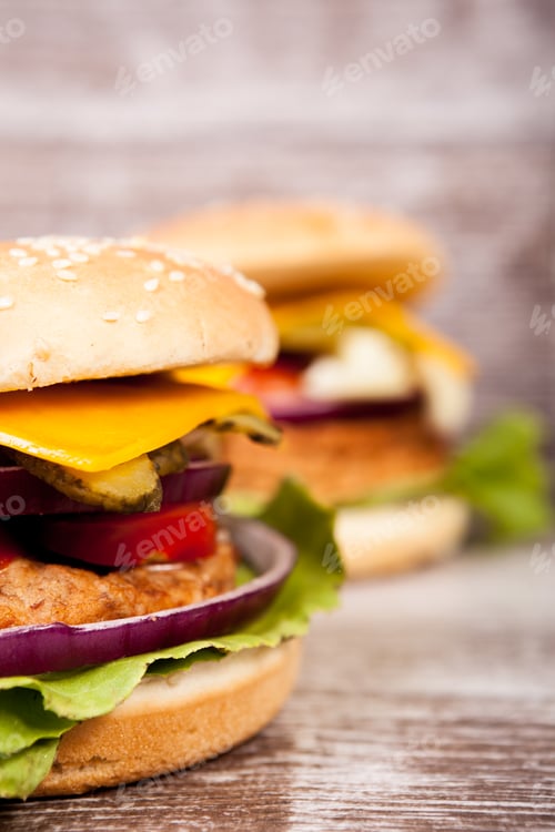 Preview: Close up of Delicious home made burgers on wooden plate