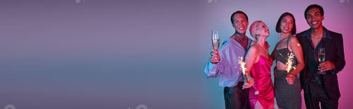 Preview: cheerful friends holding sparklers and champagne, celebrating Christmas on purple pink, banner