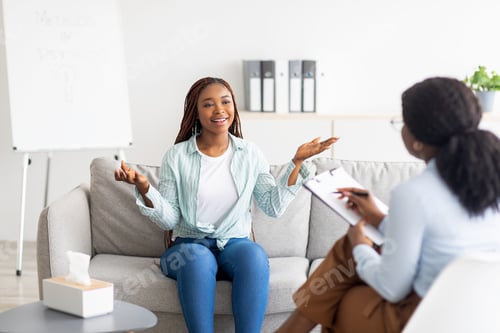 Preview: Effective therapy. Happy young black woman having session with psychologist, grateful for