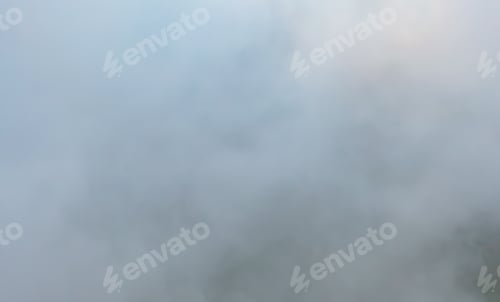 Preview: Aerial view of sunrise above fluffy sea fog misty clouds with mountain hill. Nature landscape