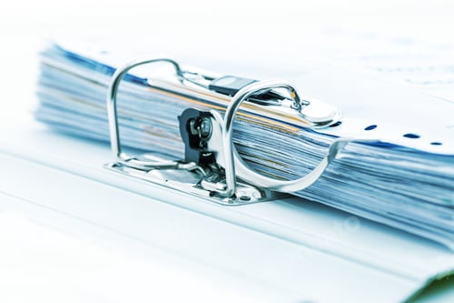 Preview: Detail of open folder filled with documents in cyan tone