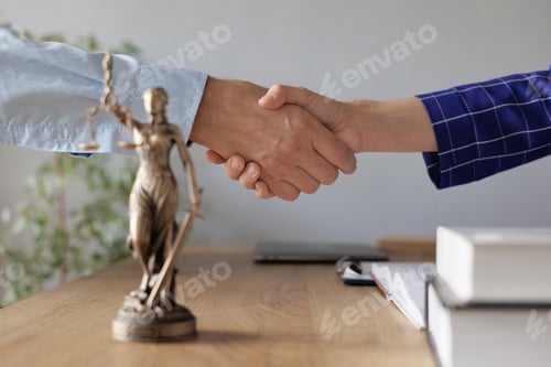 Preview: legal advice in the office or online. the handshake of two European people. two lawyers or partners