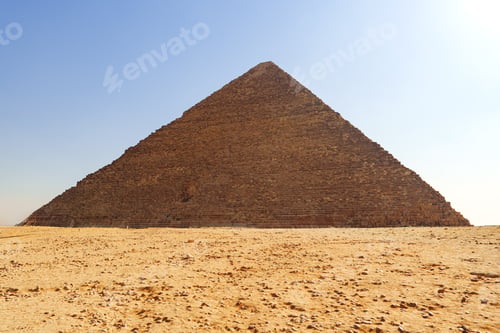 Preview: Majestic view of the Great Pyramid of Giza under a clear blue sky during midday