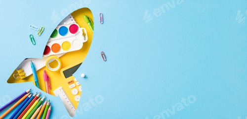 Vista previa: Creative back to school concept with school supplies in a rocket shape, including pencils