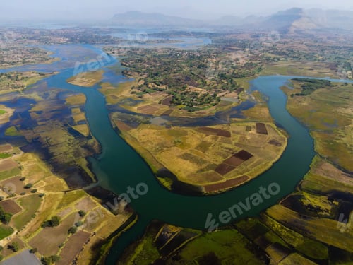 Preview: Aerial shot of the Zambezi river surrounded by cultivated land and forests