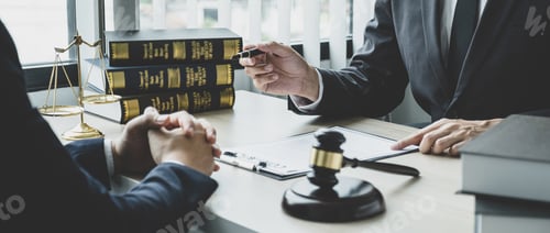 Preview: Lawyer hand holding pen and providing legal consult business dispute to the man