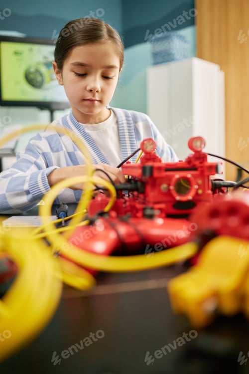 Preview: Young Girl Engaging in Robotics Project