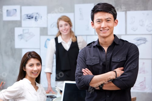 Preview: Designer and his team in background