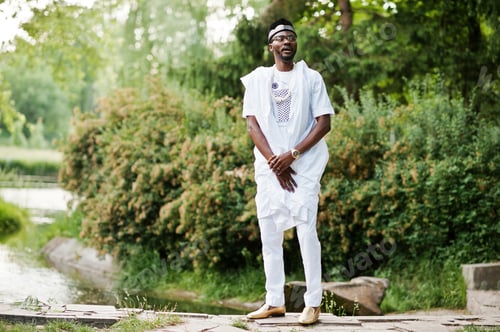 Preview: Rich black man at white national dress