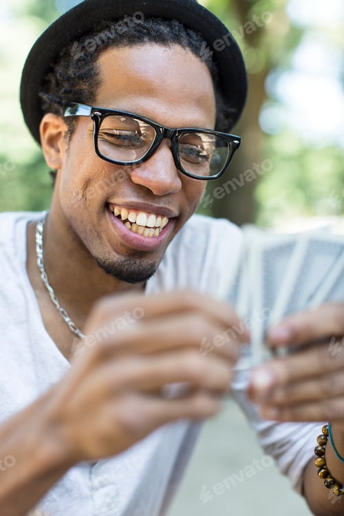 Preview: Young man playing cards