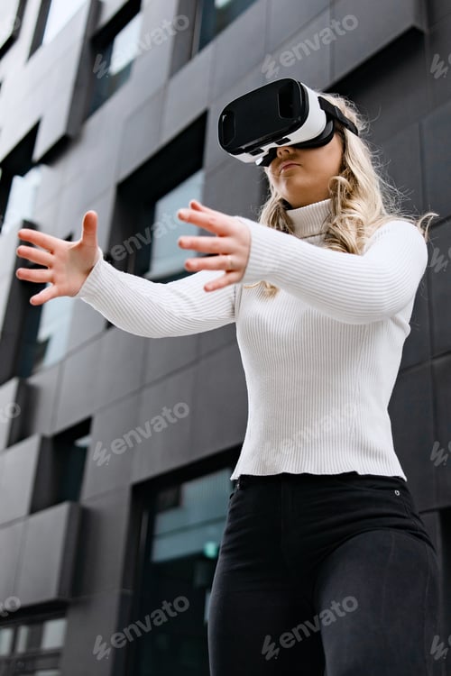 Preview: Woman Using Virtual Reality Glasses In Metaverse Business