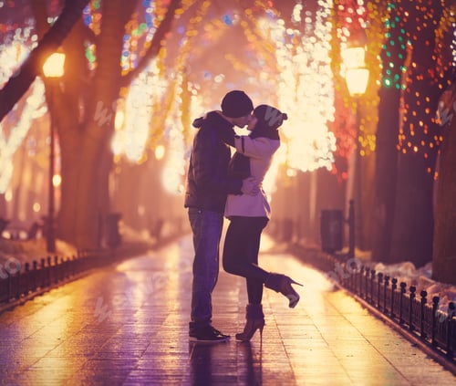 Preview: Couple kissing at night alley.
