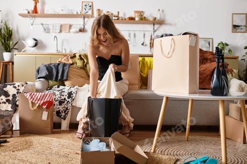Preview: Surrounded by shopping bags and joy, a young woman enjoys her stylish finds at home