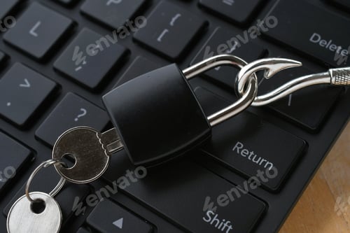 Preview: Lock on fishing hook on computer keyboard, concept fraud phishing scam security breach hacked