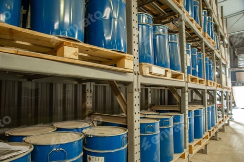 Preview: Warehouse with blue industrial metal barrels