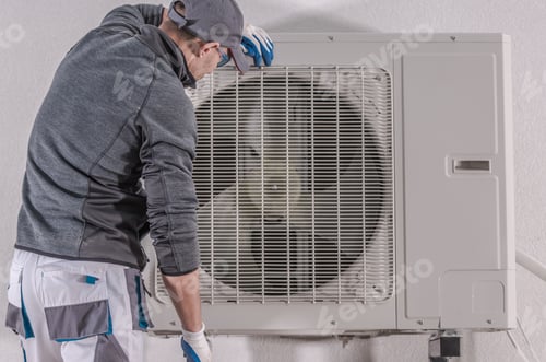 Preview: Maintenance Worker Inspecting Air Conditioner Unit