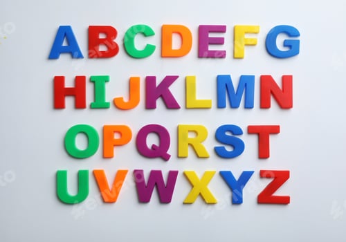 Preview: Plastic magnetic letters isolated on white, top view. Alphabetical order