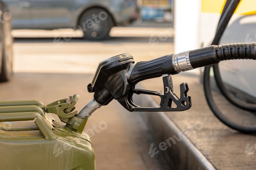 Preview: Refilling canister with fuel on the petrol station. Close up view. Fuel, gasoline, diesel